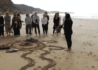 A Welcome to Country ceremony being performed on the beach